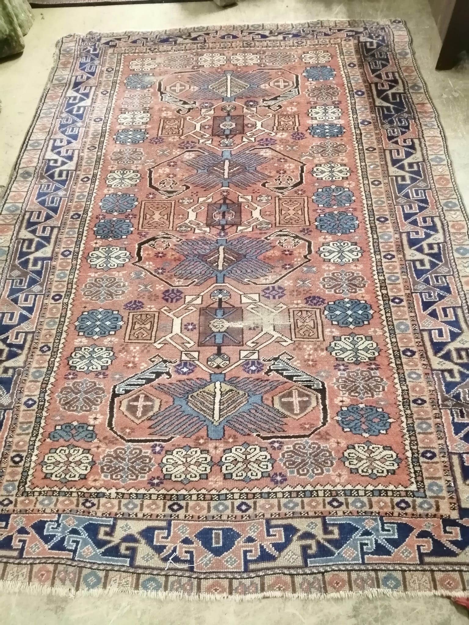 A Shirvan brick red ground rug, 236 x 164cm